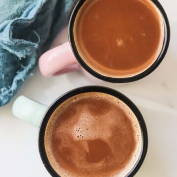 Chocolate milk in two mugs.