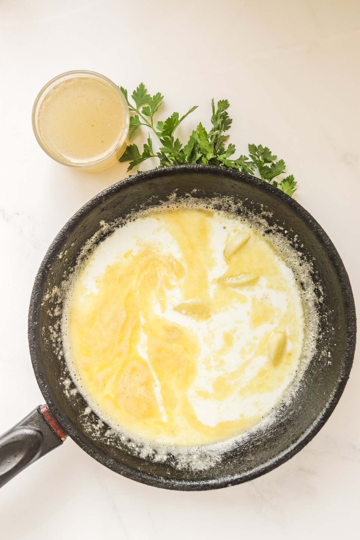 The liquid ingredients in a skillet.