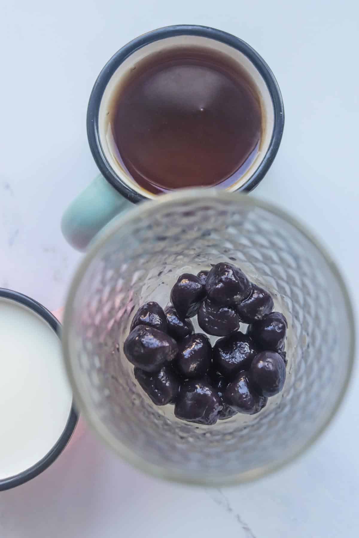 Black tapioca pearls in a glass.