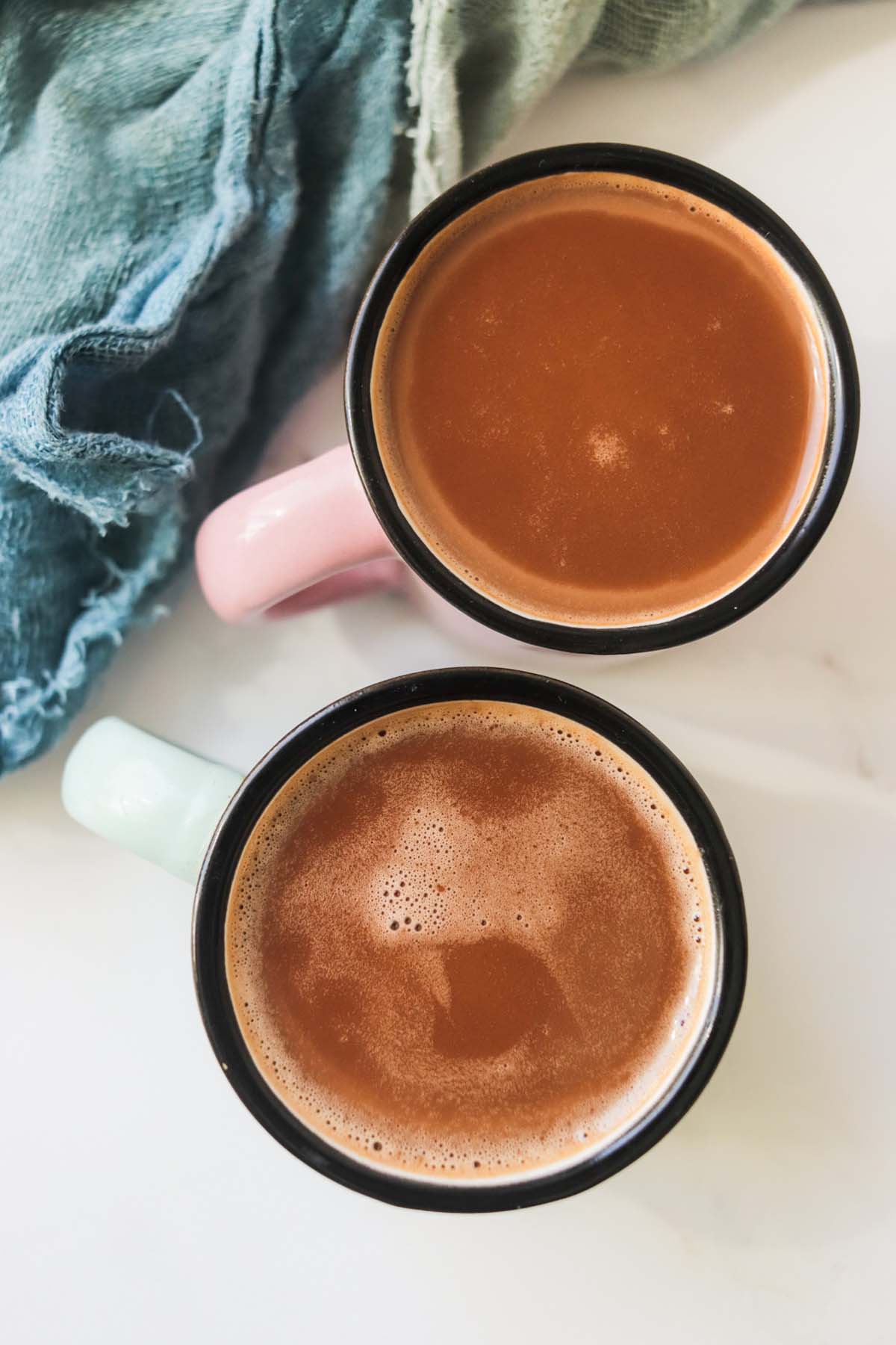 Chocolate milk in two mugs.