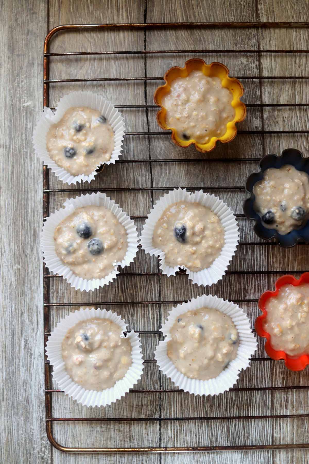 Muffin batter in cupcake liners.