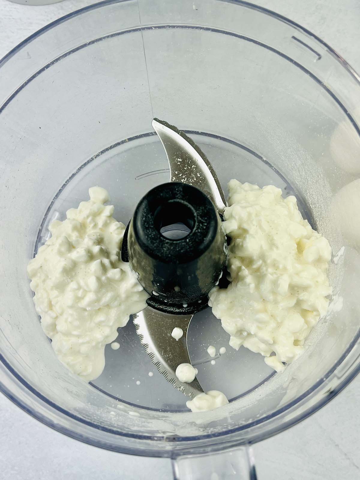 Cottage cheese in a food processor.