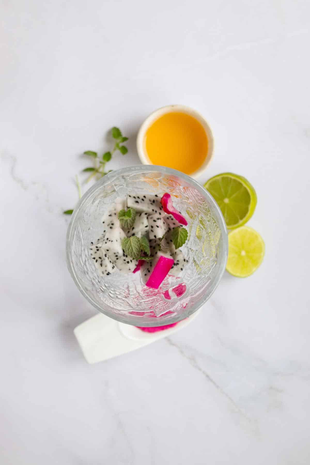 Dragon fruit, and mint in a glass.