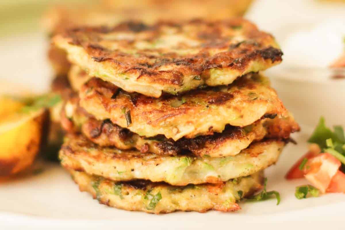 A stack of fritters on a plate.