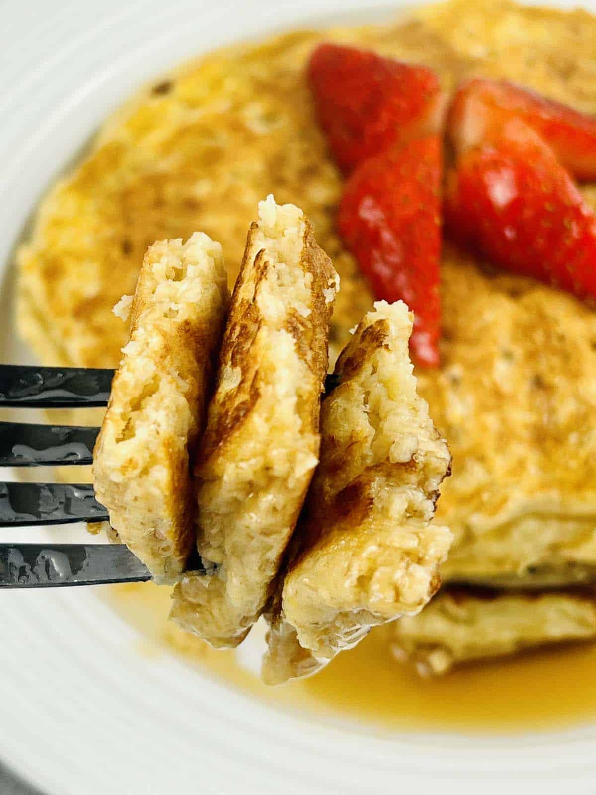 Pieces of pancake on a fork.