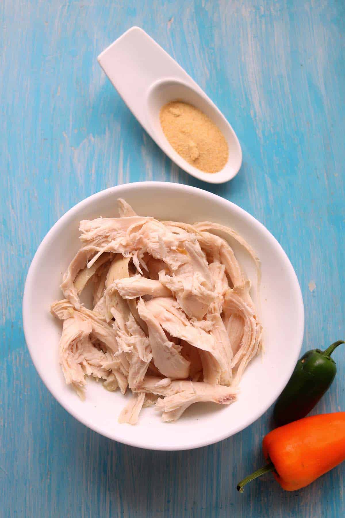 Shredded rotisserie chicken in a bowl.