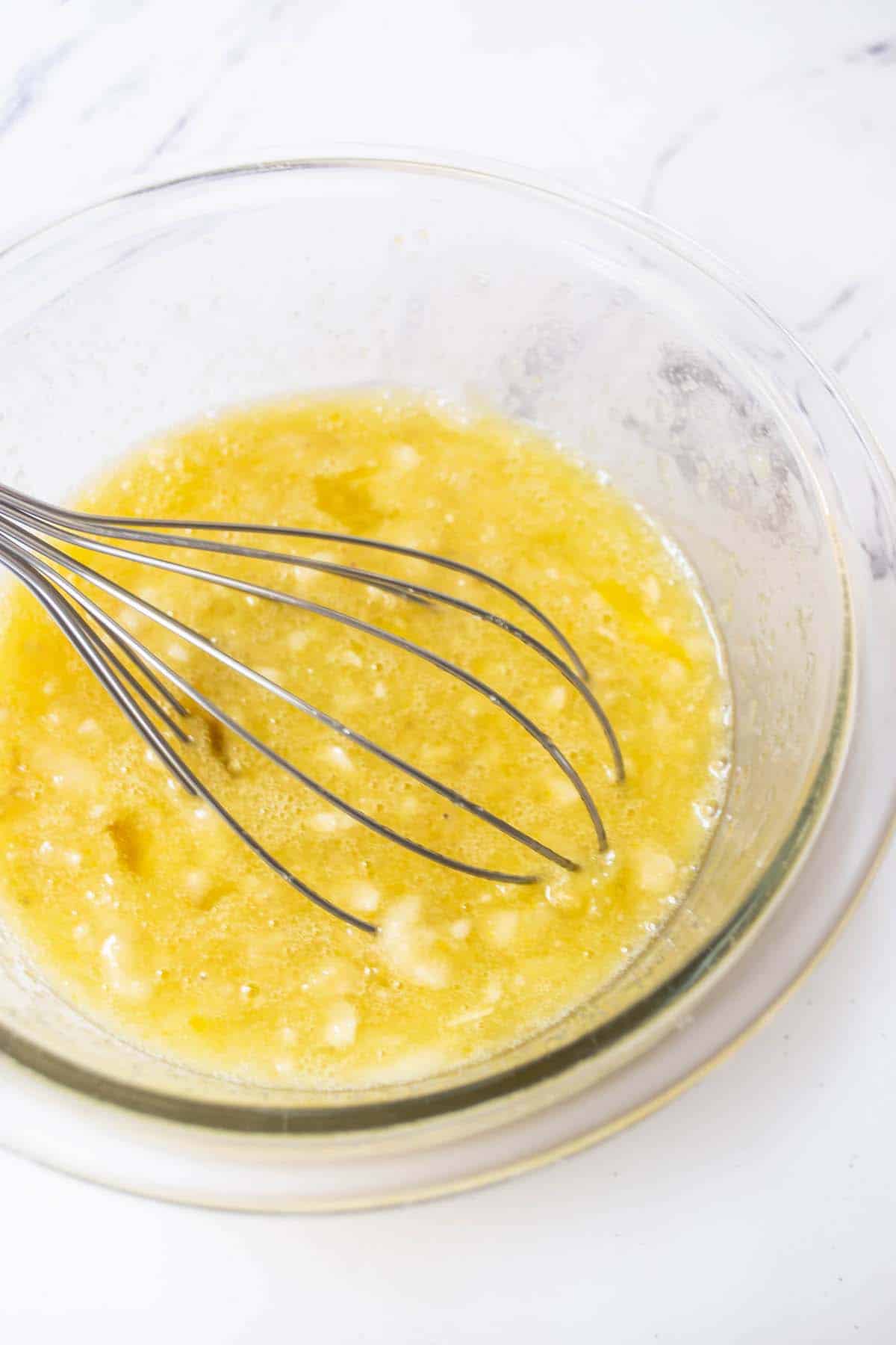 The wet ingredients whisked together in a mixing bowl.