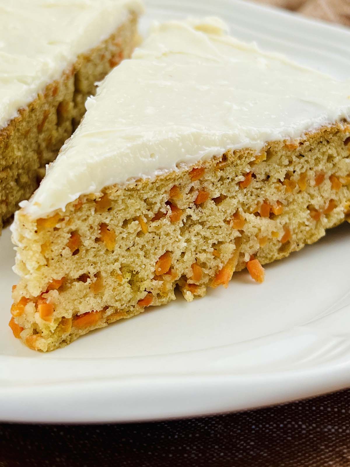 A slice of carrot cake on a plate.