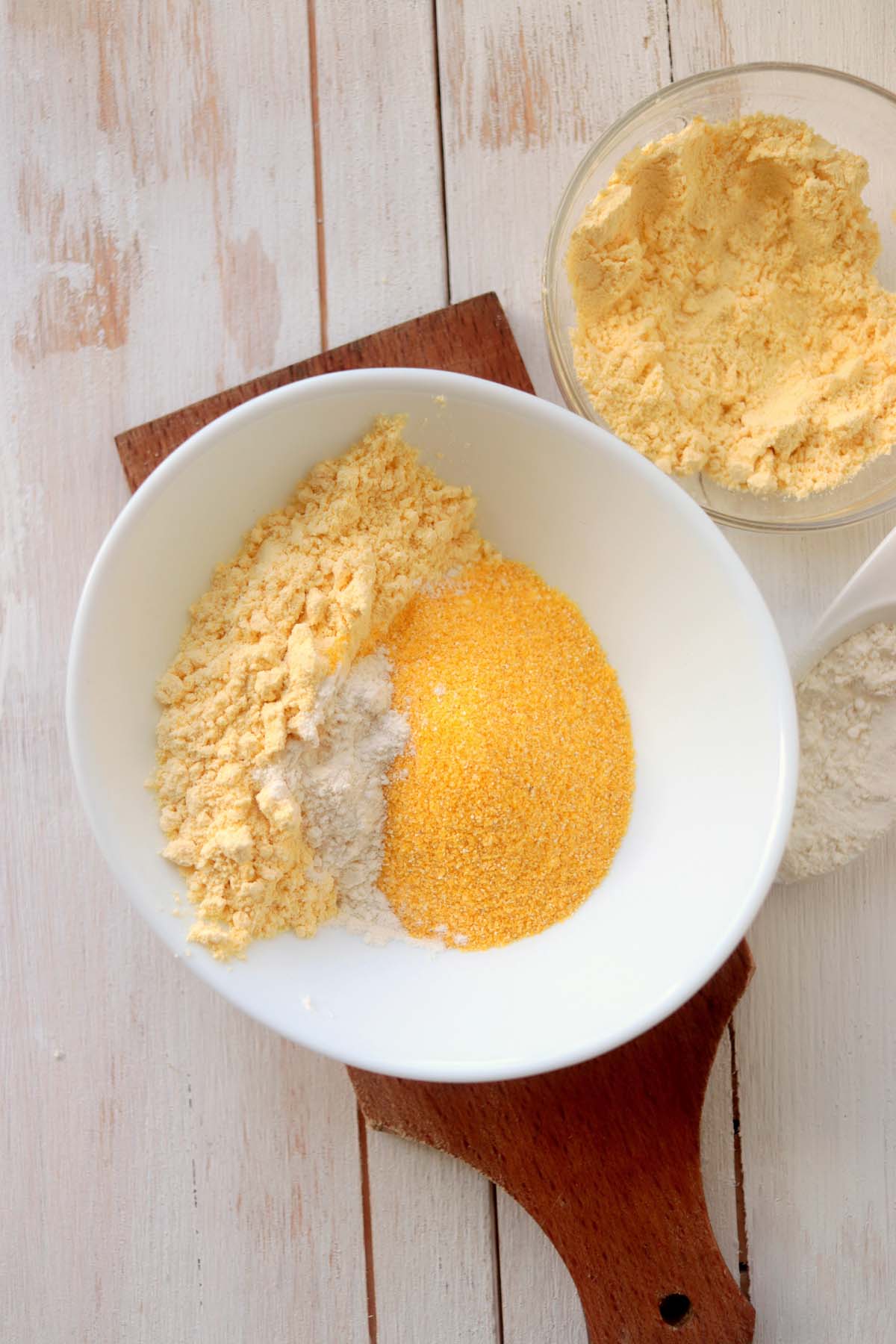 Cornmeal and baking powder in a bowl.