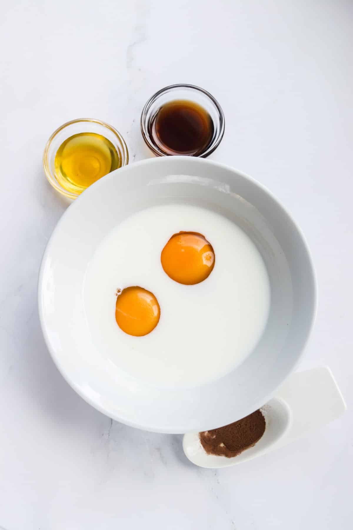 Eggs and milk in a bowl.