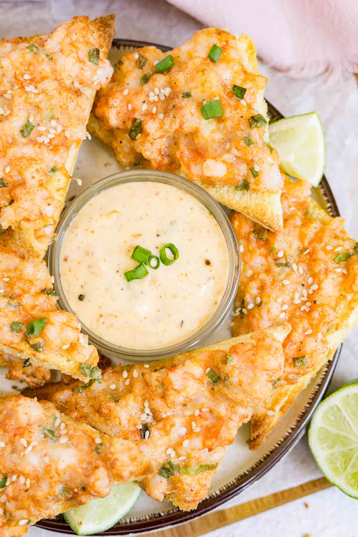 Shrimp toast on a serving plate with dip