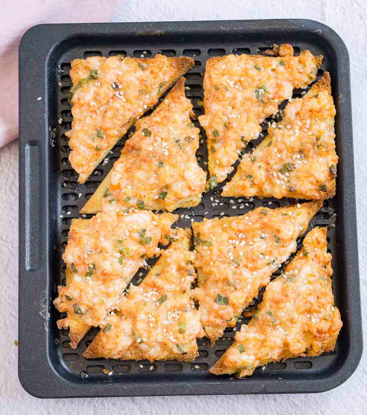 Air fried shrimp toast on an air fryer tray