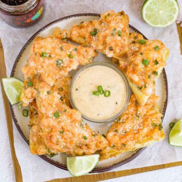 Platter of shrimp toasts with spicy mayo dip