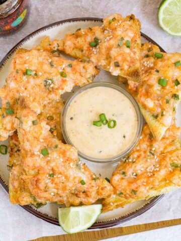 Platter of shrimp toasts with spicy mayo dip